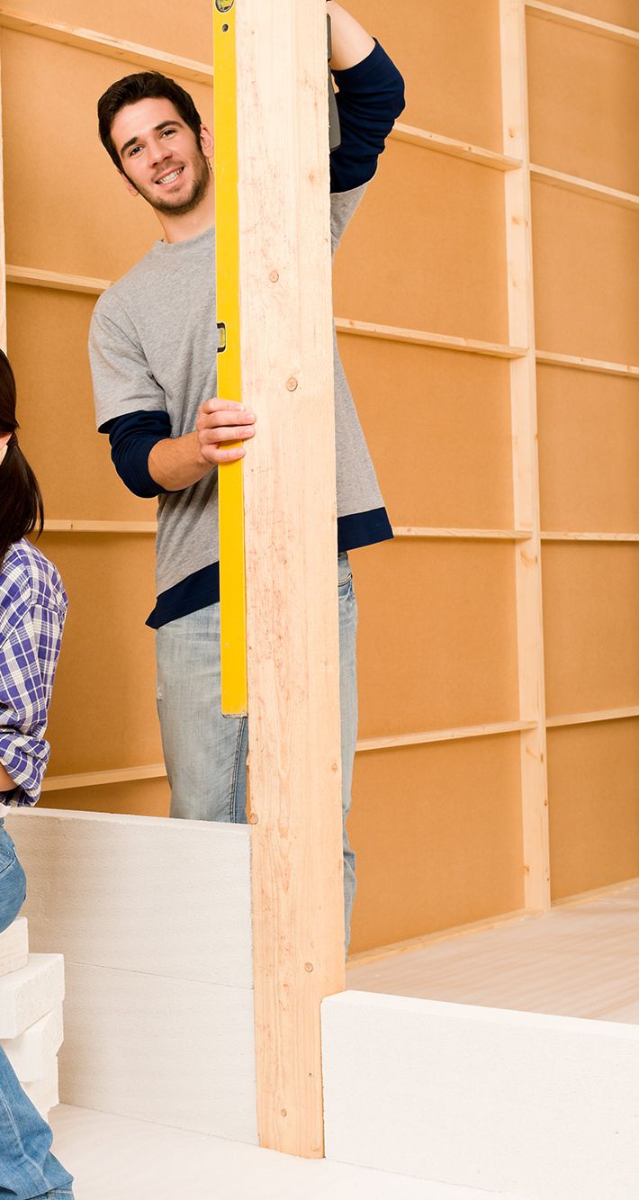 Home improvement young couple with blueprints