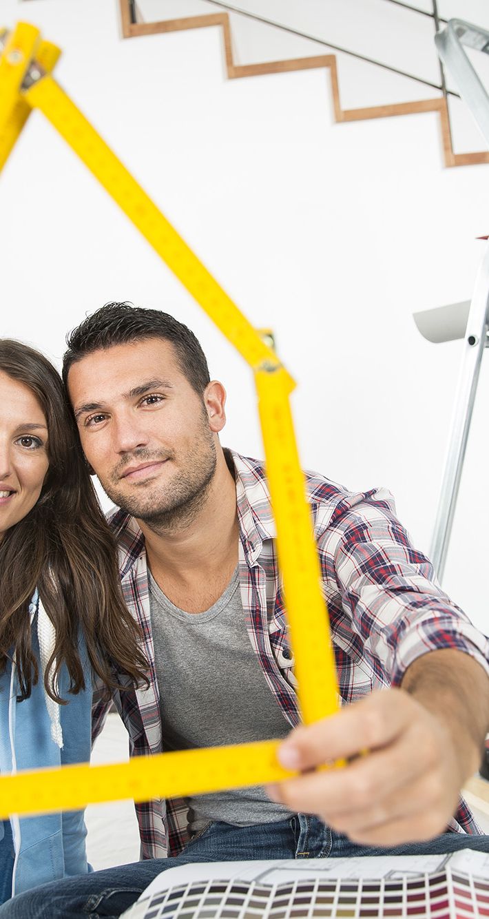 couple in new home choosing wall paint colors